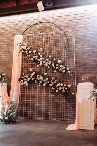 rustic flower wall on metal frame at wedding
