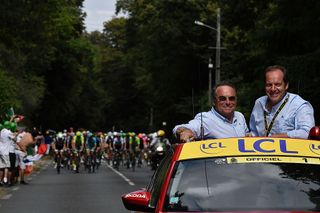 Tour de France race director Christian Prudhomme (right) – with five-time Tour winner Bernard Hinault – directs the action from his red Skoda on the final stage of the 2016 Tour de France