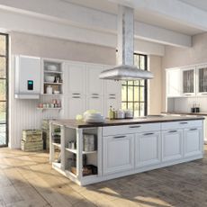 Boiler in white kitchen with wooden floor