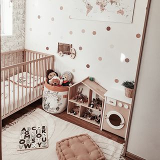 Warm chocolate coloured nursery with wall stickers