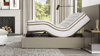Image shows the Saatva Adjustable Bed Base placed in a zero gravity sleeping position