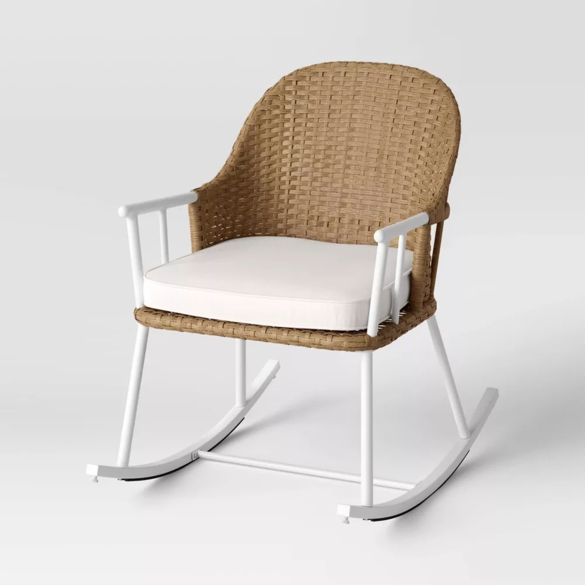 Outdoor wicker rocking chair with white metal frame