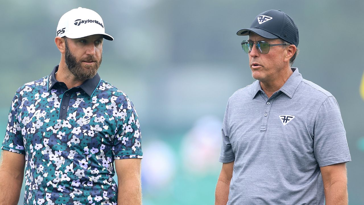 Dustin Johnson and Phil Mickelson during a practice round before the 2023 Masters at Augusta National