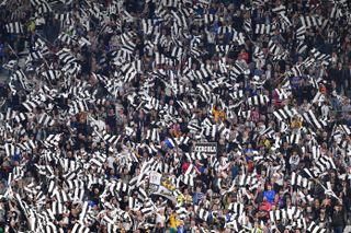 Juventus fans wave flags at the end of their Champions League semi-final second lag against Monaco in May 2017.