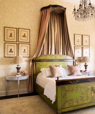 bedroom with chandelier, coronet and green hand painted bed and wallpaper