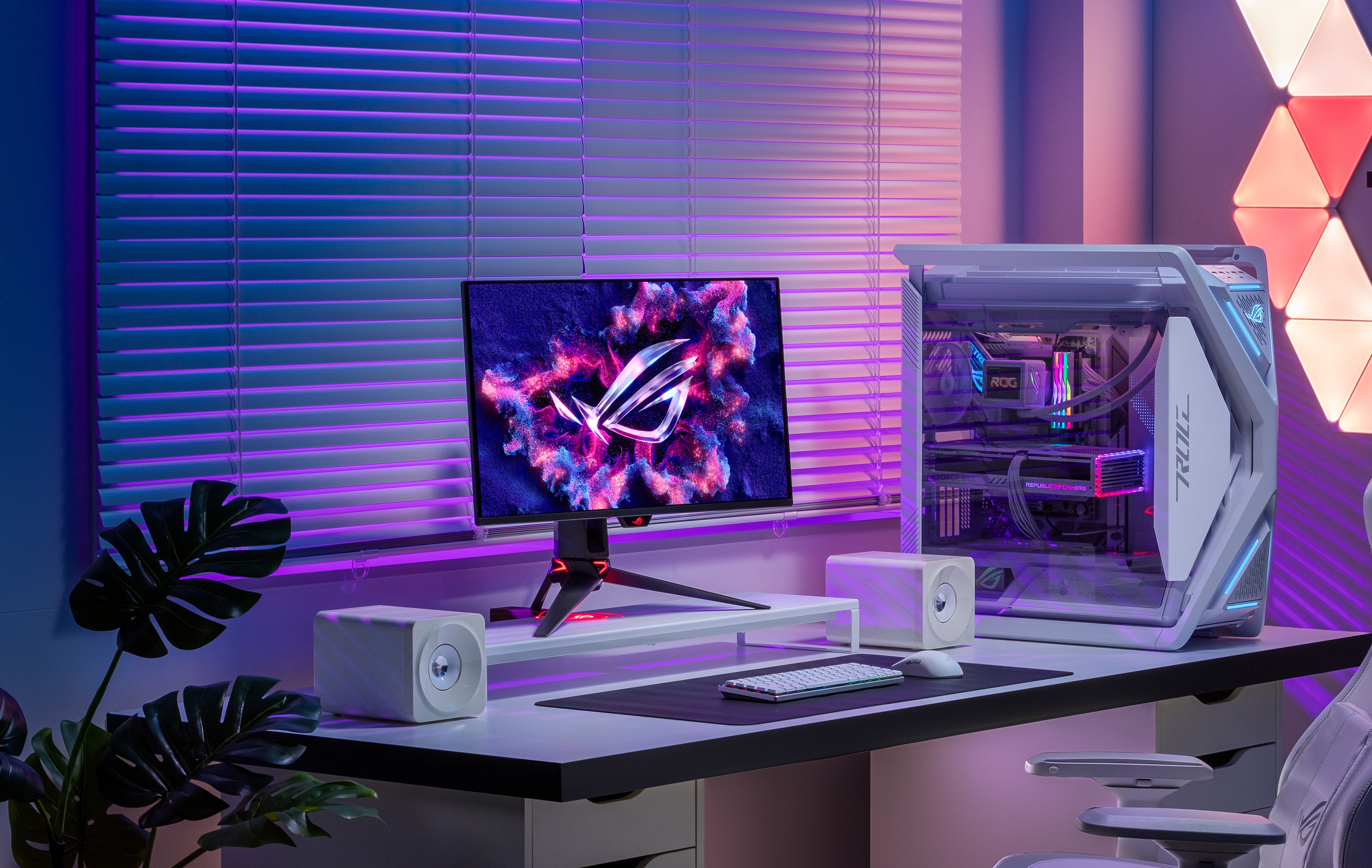 ASUS monitor on a desk with a gaming PC