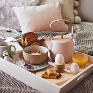 Breakfast in bed served on bed tray