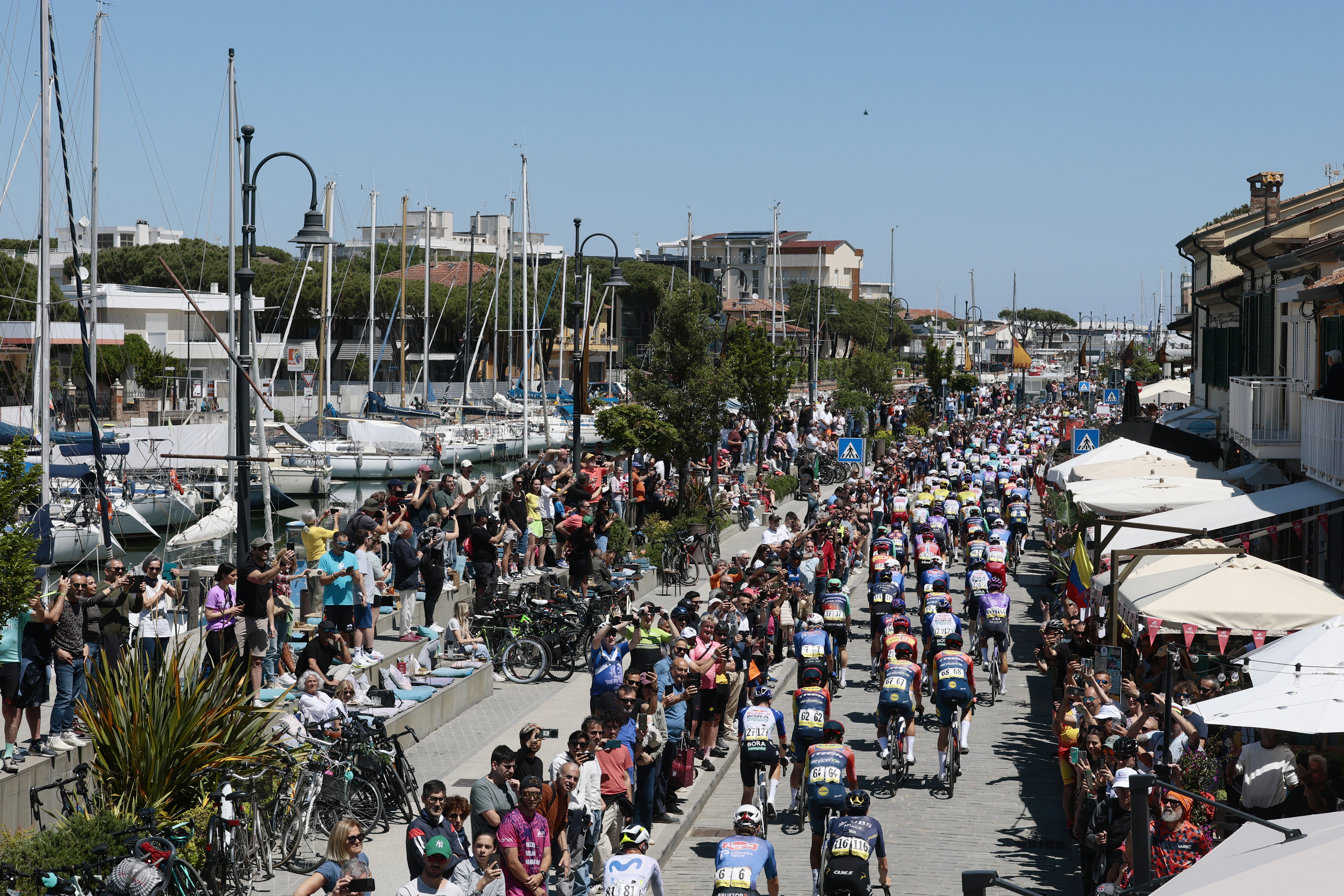 Riders arrive to take the start of the 9th stage of the Giro d'Italia 2026 - Tour of Italy cycling race between Cervia and Corno alle Scale, central Italy on May 17, 2026. (Photo by Luca Bettini / AFP)
