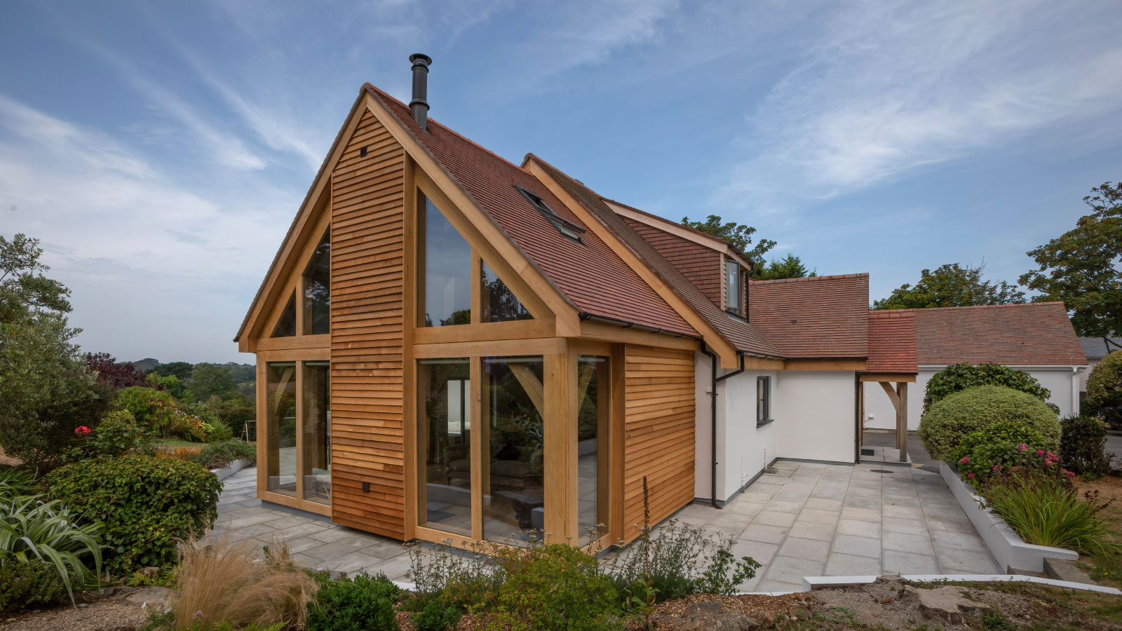 modern oak frame extension on white rendered bungalow