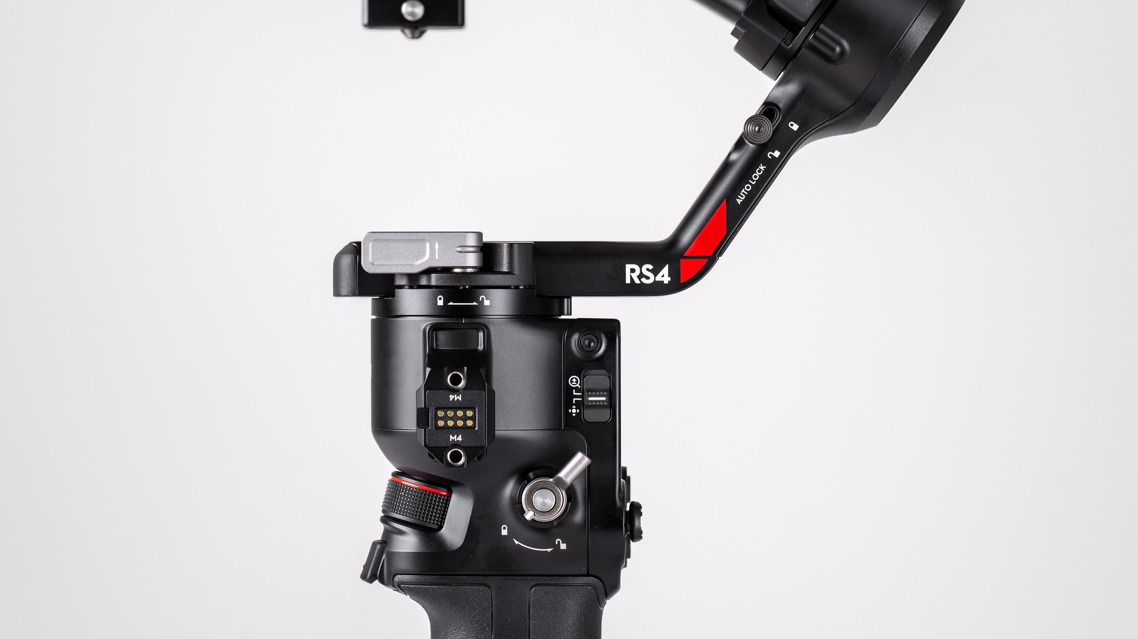 DJI RS 4 gimbal controls closeup on a off-white background