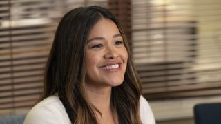Gina Rodriguez as Nell smiling in Not Dead Yet season 2