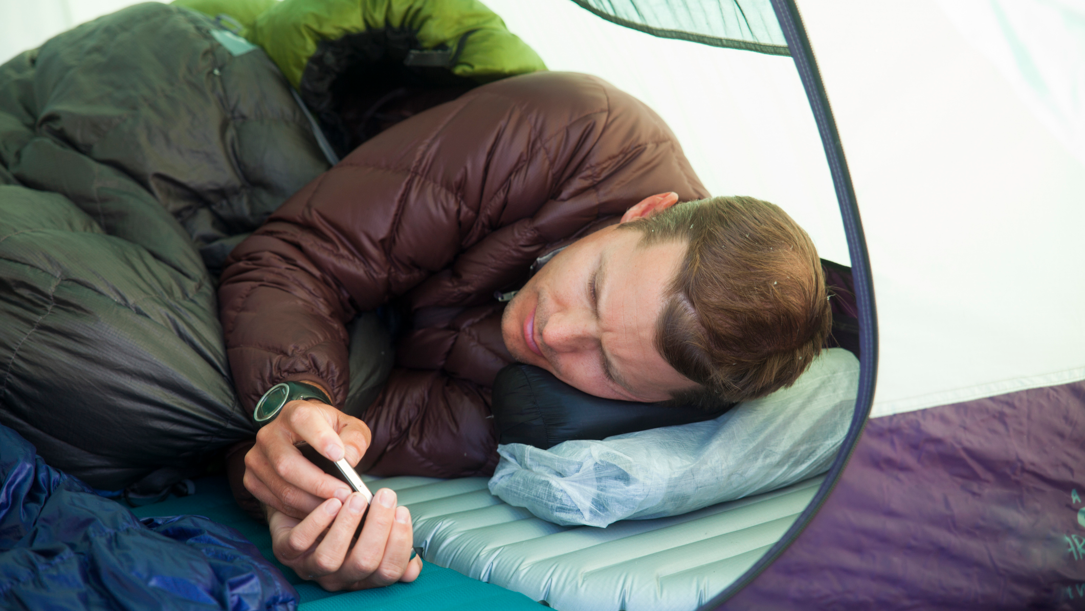 Man sleeps in a tent
