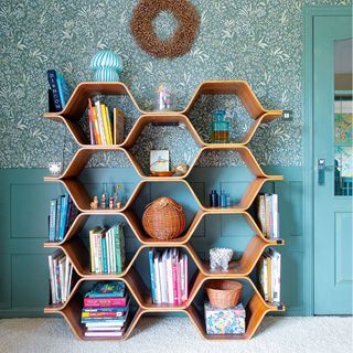 colourful living room with wallpaper and shelving unit