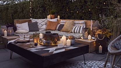 outdoor seating area with garden lighting and lanterns