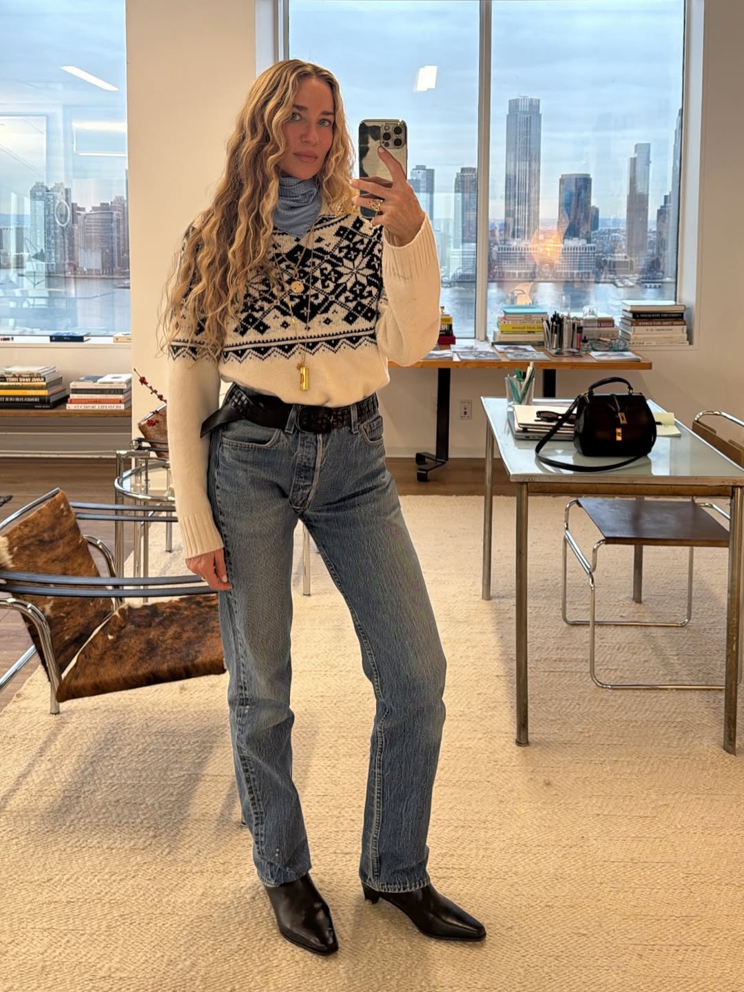 olympia gayot wears a fairisle cashmere jumper with jeans and boots