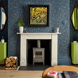 drawing room with blue wallpaper and frame on wall