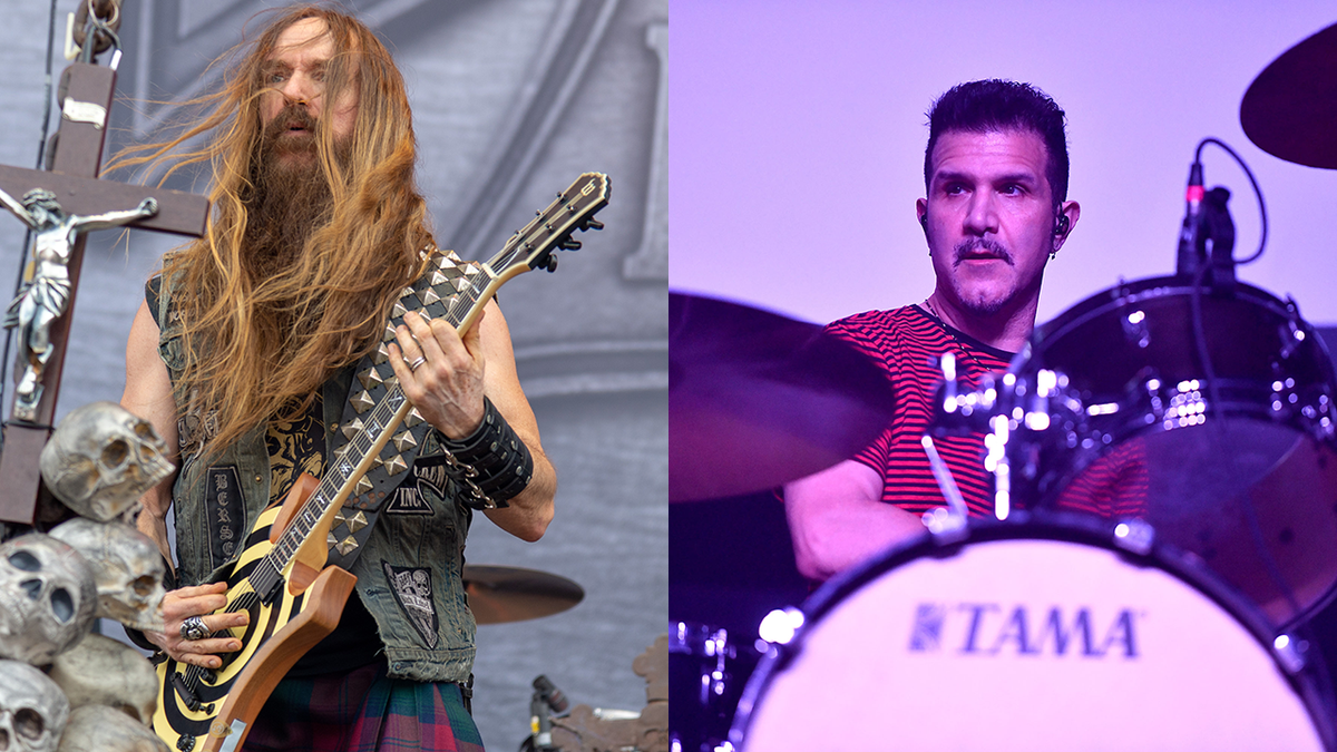 Zakk Wylde playing guitar on stage next to Charlie Benante behind a drum kit