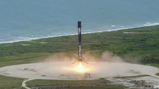 A SpaceX Falcon 9 rocket touches down at Cape Canaveral Space Force Station in Florida after launching the Transporter-2 rideshare mission to orbit, on June 30, 2021.