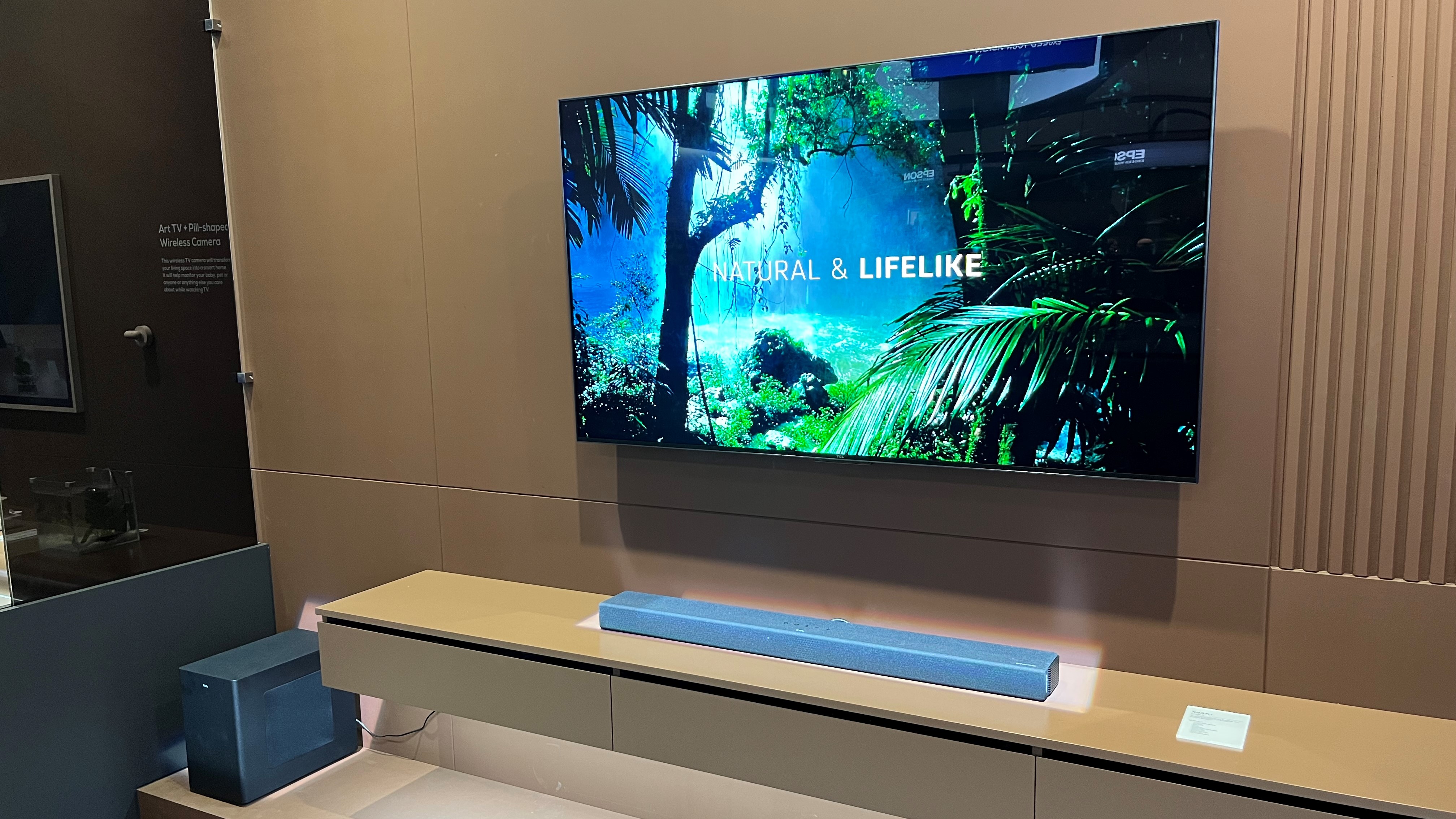 TCL X937U soundbar in trade show booth with TCL TV