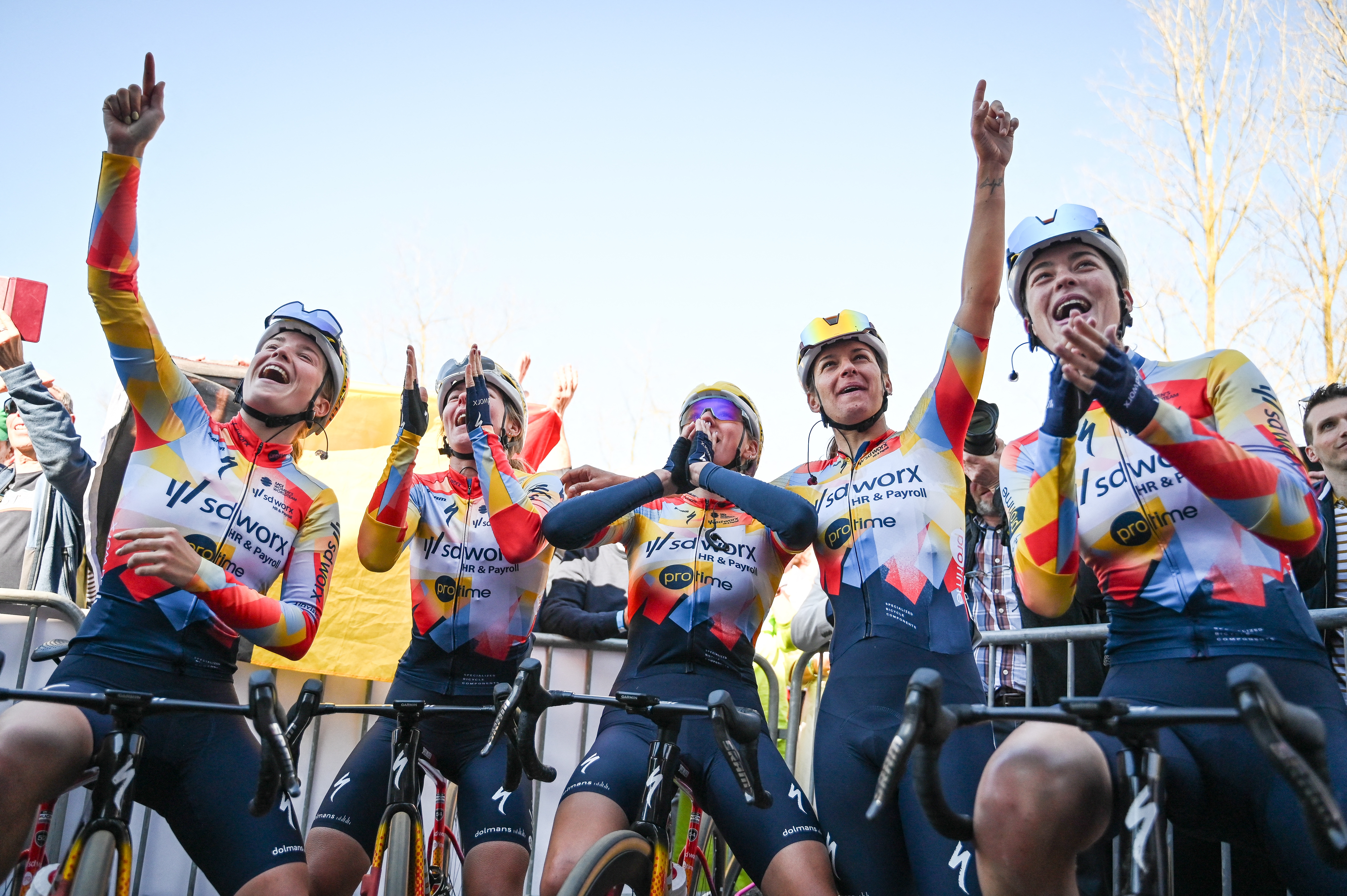 SD Worx-Protime riders celebrate the victory of their teammate Lotte Kopecky (not pictured) after the 'Nokere Koerse' one day women cycling race, 133,3km from Deinze to Nokere, on March 18, 2026. (Photo by ELIAS ROM / Belga / AFP) / Belgium OUT