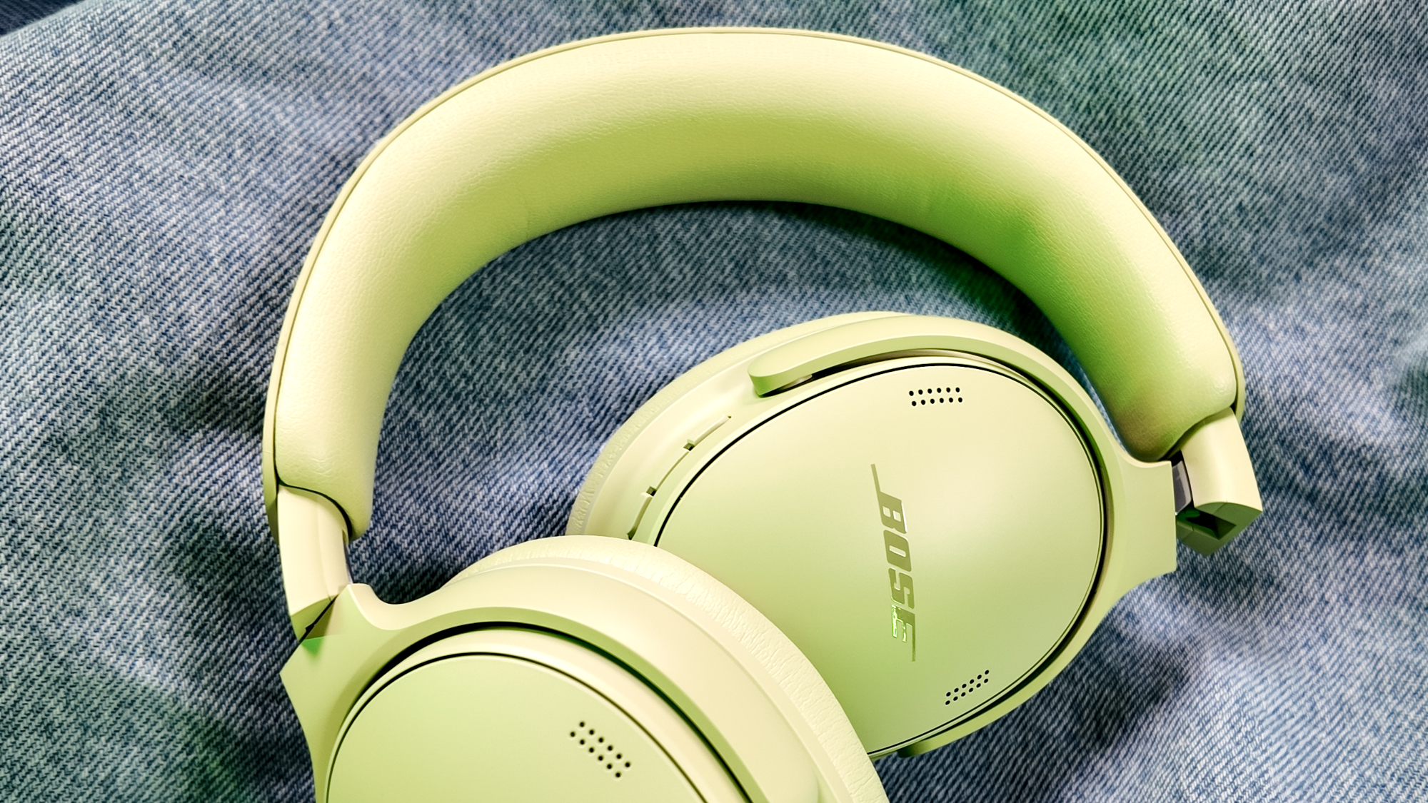 Bose QuietComfort Headphones (2nd Gen) sitting on a denim jacket