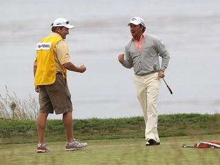 PEBBLE BEACH, CA - JUNE 20: Graeme McDowell of Northern Ireland celebrates with his caddie Ken Comboy after making par on the 18th hole to win the 110th U.S. Open at Pebble Beach Golf Links on June 20, 2010 in Pebble Beach, California. (Photo by Andrew Redington/Getty Images)