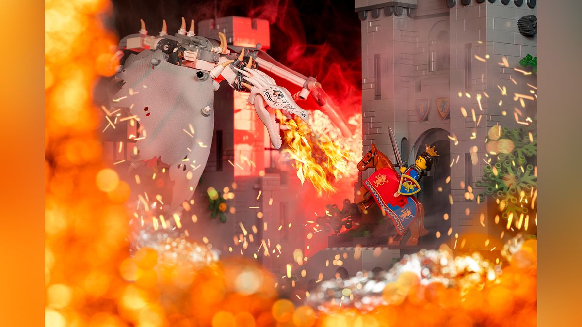 Cinematic toy photo of Lego dragon breathing fire on Lego queen, within a castle setting 