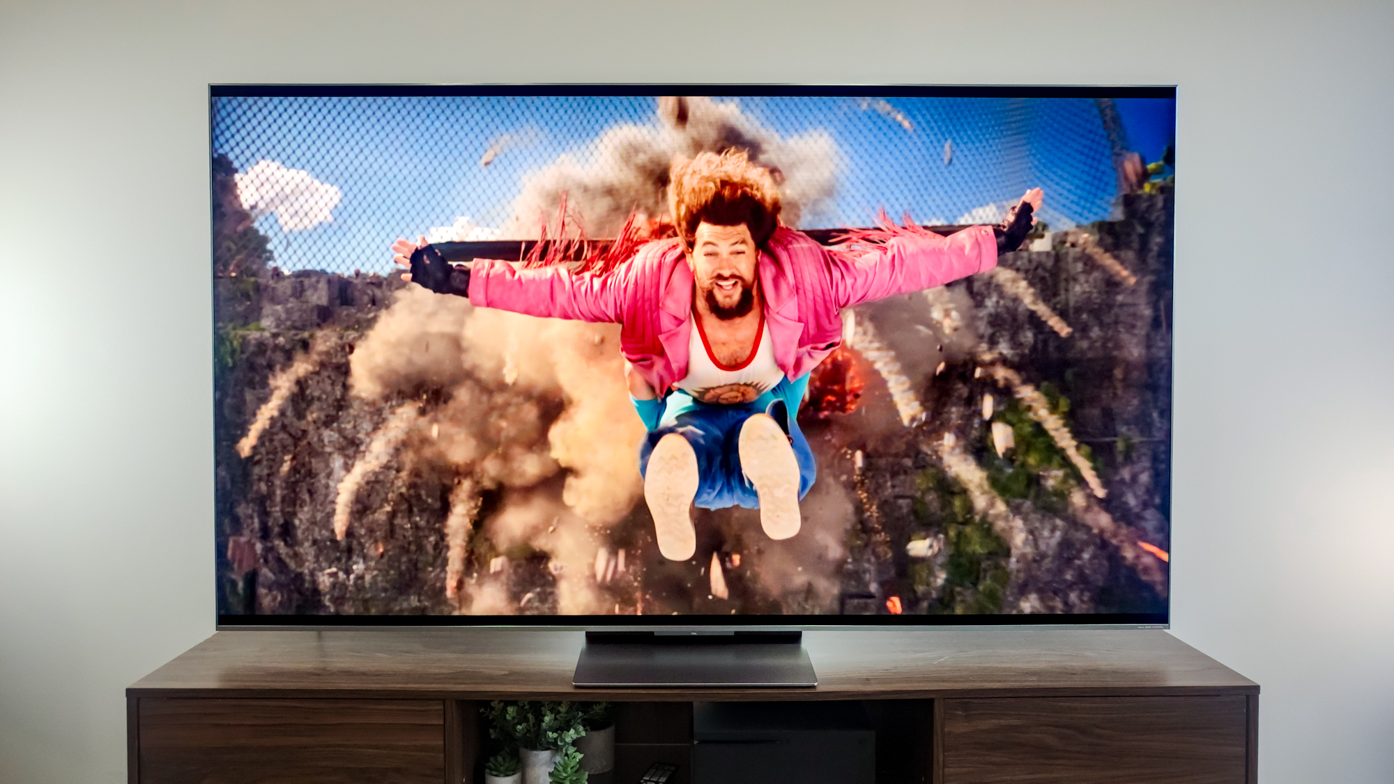 A TCL QM9K TV on a side table
