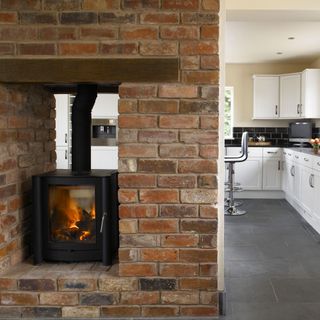 Brick wall with kitchen and fireplace
