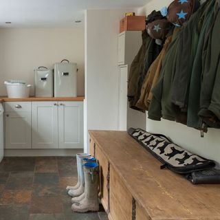 Neutral utility room with space to hang coats