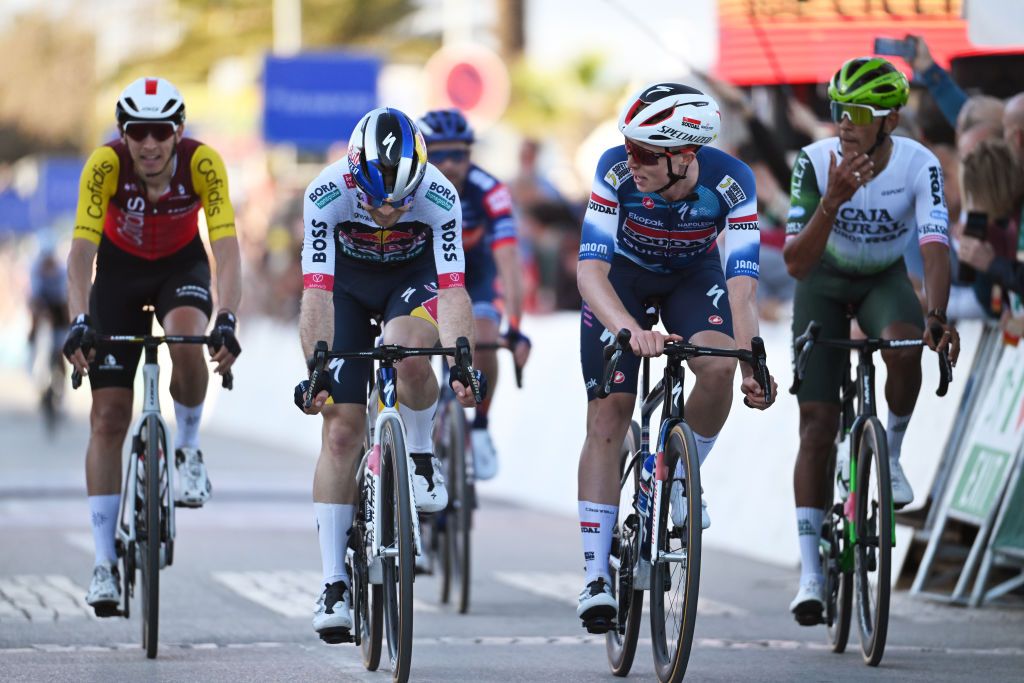 LAGOS PORTUGAL FEBRUARY 19 LR Jan Tratnik of Slovenia and Team Red Bull BORA hansgrohe and Gil Gelders of Belgium and Team Soudal QuickStep cross the finish line during the 51st Volta ao Algarve em Bicicleta Stage 1 a 1922km stage from Portimao to Lagos on February 19 2025 in Lagos Portugal Photo by Tim de WaeleGetty Images