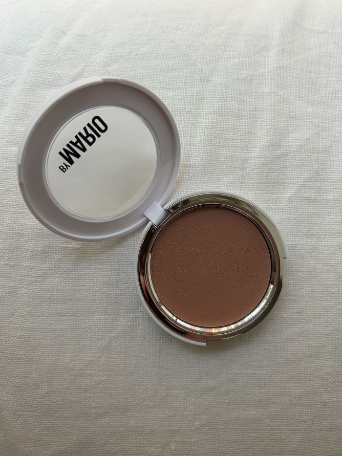 The Makeup By Mario Soft Sculpt Transforming Skin Enhancer on a white linen background