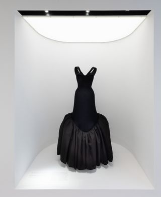 Gallery view of The Met’s Sleeping Beauties Reawakening Fashion, featuring tulip-shaped black gown