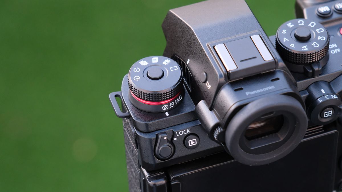 Close up of the dials and buttons on a Panasonic Lumix S1R II camera top panel