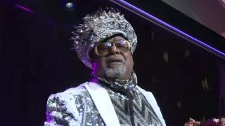 George Clinton in white and grey, performing on stage in 2017 at the SESAC Pop Awards