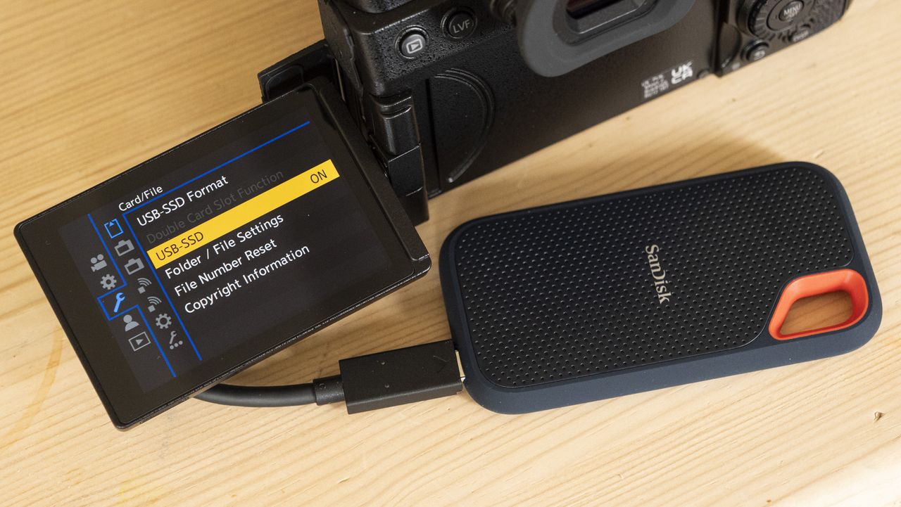 Panasonic Lumix S5 IIX camera on a table with SSD attached