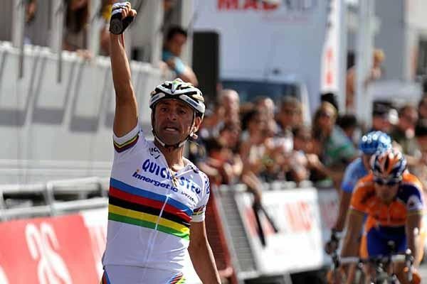 Paolo Bettini (Quick Step) celebrates as his squad makes up for its disappointing Tour de France.