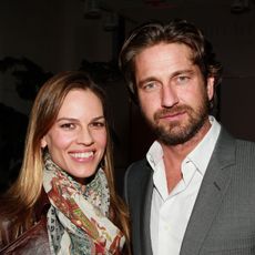 Actors Hilary Swank (L) and Gerard Butler attend the 2011 Film Independent Spirit Awards Voter Party at Santa Monica Place on February 26, 2011 in Santa Monica, California.