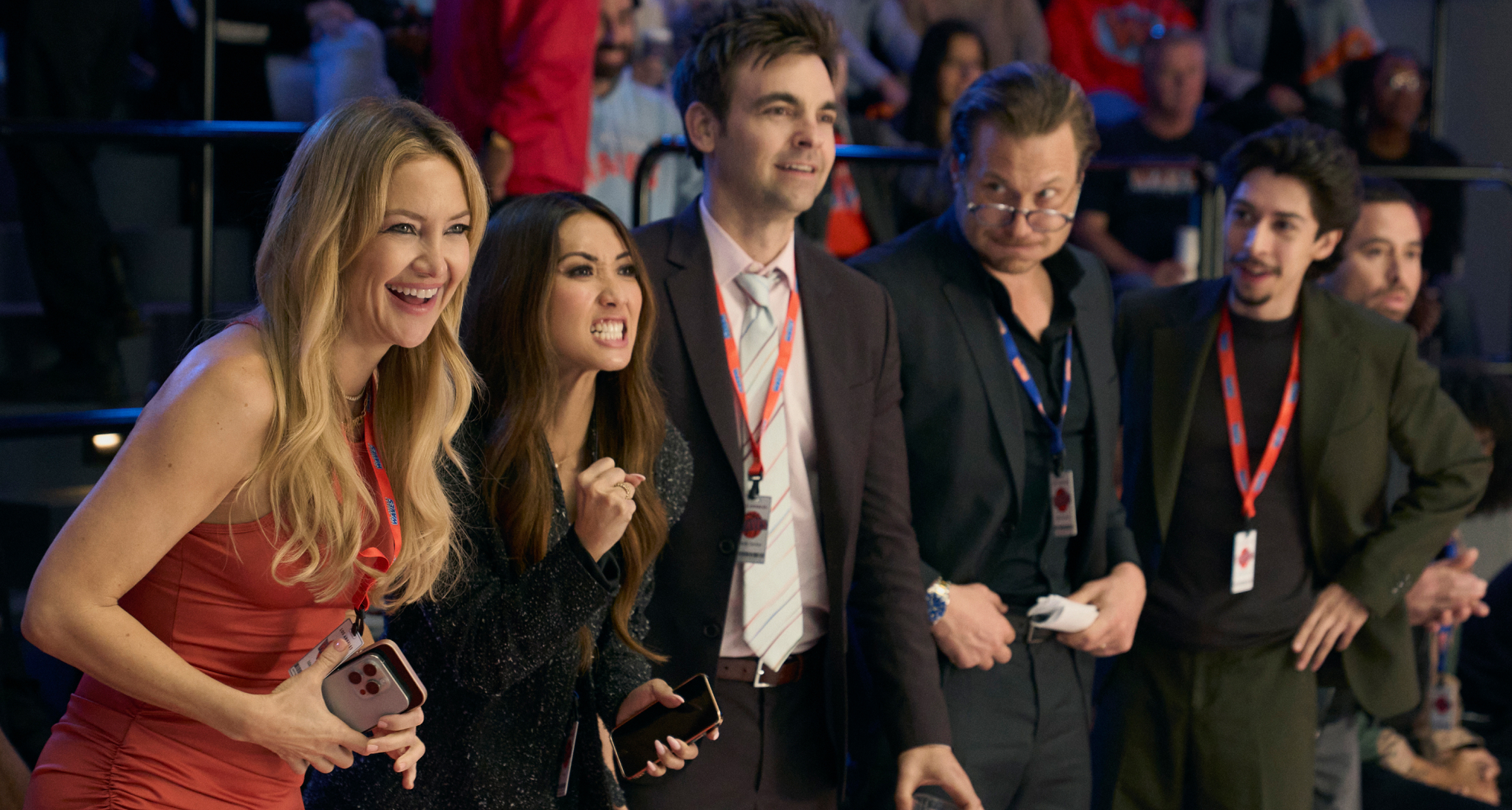 kate hudson brenda song drew tarver and more as the waves basketball team owners standing sideline at a game in the tv show running point