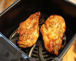 Two skinless chicken breasts cooked using the Gourmia 4-quart digital air fryer