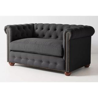 A buttoned love seat