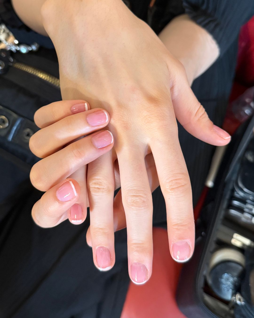 An image of the baby French tip nails backstage at Sandy Liang spring/summer 2026.