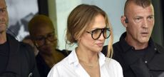 Jennifer Lopez wearing sunglasses and a white shirt