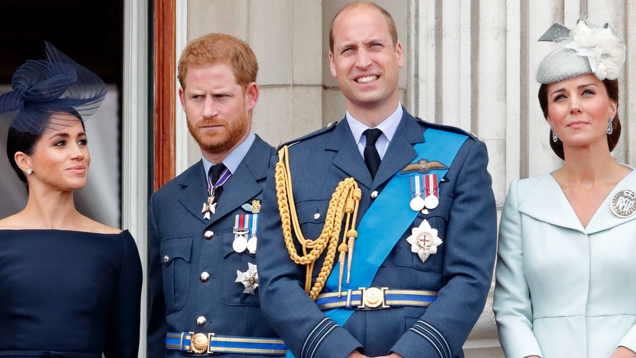 Meghan Markle, Prince Harry, Prince William, and Kate Middleton watch a flypast to mark the centenary of the Royal Air Force from the balcony of Buckingham Palace on July 10, 2018.