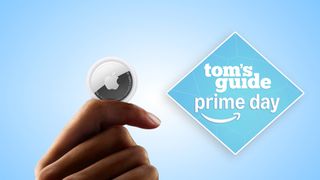 An AirTag on a blue Tom's Guide background