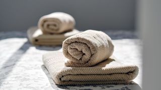 folded towels on bed