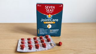 Blister pack of Seven Seas JointCare Supplex on a table