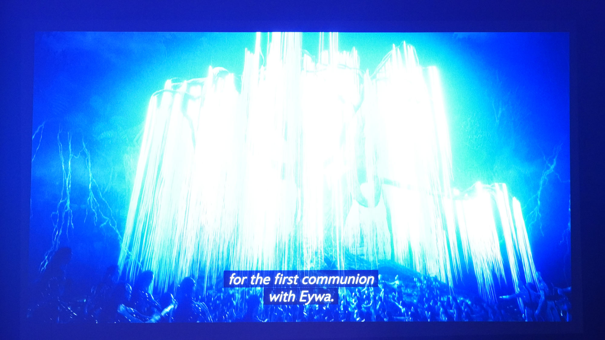 The projection from a JMGO N1S Ultimate projector displaying a bright scene from Avatar: The Way of Water.