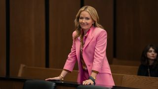 Becki Newton as Lorna Crane smiling in court in The Lincoln Lawyer season 3 episode 2