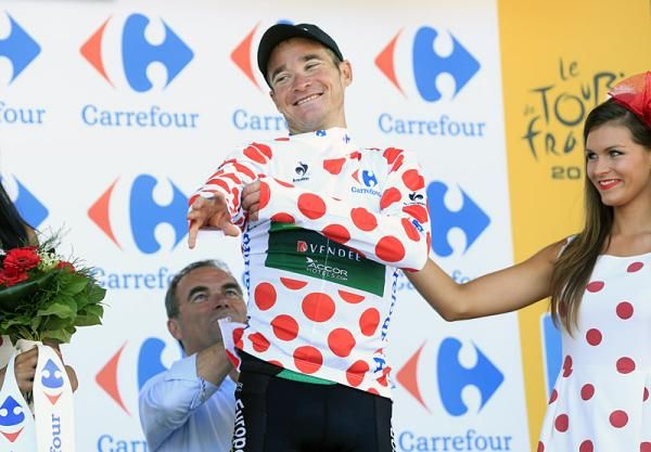 Thomas Voeckler (Europcar) gets some help from Bernard Hinault with the mountains classification jersey.